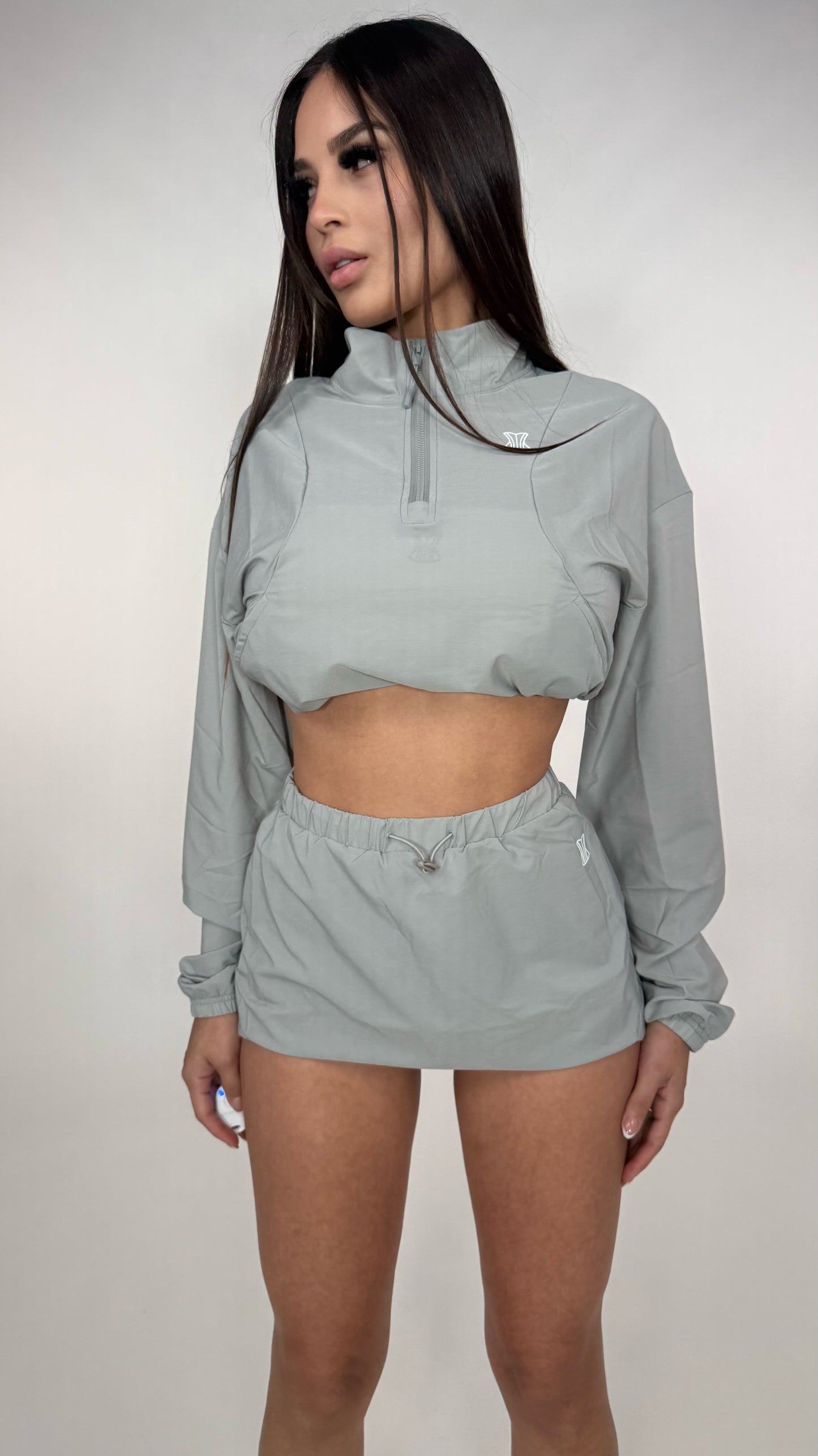 Set abrigo y falda impermeable