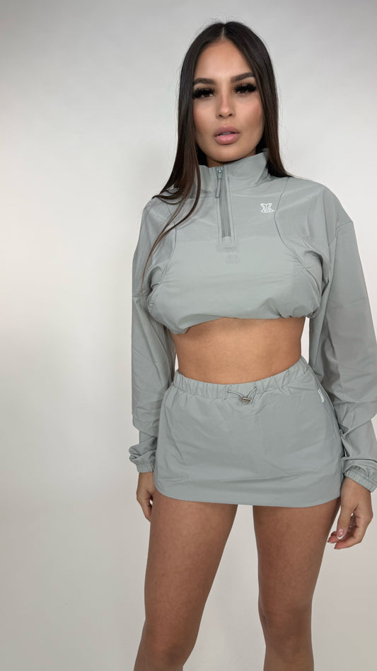 Set abrigo y falda impermeable